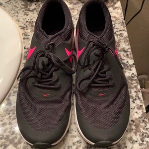 Black with pink Nike sign tennis